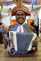 Brazil Photo - Man with a pirates hat plays the accordion at the Boneco museum in Olinda.
