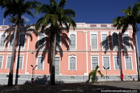Pink building with palm trees in the historical center of Joao Pessoa at Plaza San Francisco, well-maintained. Brazil, South America.