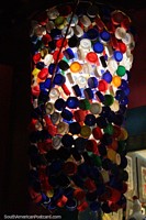 A light made out of colored bottle-tops in the main street in Pipa. Brazil, South America.