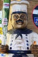 Larger version of Figure of a chef outside a shop selling food at the Central Market in Belo Horizonte.