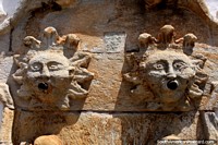Ancient sun faces, a fountain on the front facade of the Conspiracy Museum in Ouro Preto. Brazil, South America.