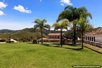 Larger version of Beautiful lawns and palm trees around Church Igreja Nossa Senhora do Carmo in Ouro Preto.