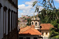 The Church of Santa Efigenia can be seen across the valley on the hilltop from all around Ouro Preto. Brazil, South America.