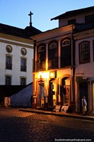 Brazil Photo - The golden lights and shapes of the buildings at dusk in Ouro Preto.