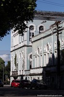 Larger version of Antique building with round windows in Manaus.