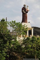 Religious monument overlooks the Amazon river in Santo Antonio do Ica. Brazil, South America.