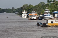 Boats and fuel stations along the side of the Amazon River in Santo Antonio do Ica. Brazil, South America.