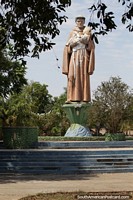 Saint Benedict holding a child, large statue at the plaza named after him in Barra do Garcas.