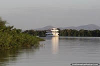 Multistory passenger boat cruises the Paraguay River in the Pantanal around Corumba. Brazil, South America.
