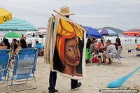 Larger version of Man sells wall hangings along Santinho Beach in Florianopolis.