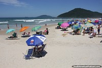 Larger version of Hot summers day in February at Brava Beach in Florianopolis with many umbrellas.