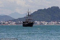 Pirates sailboat moored off Ponta das Canas Beach in Florianopolis. Brazil, South America.