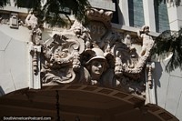 Detailed ceramic work above the entrance of an antique building from 1913 in Porto Alegre. Brazil, South America.