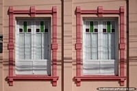 Pair of pink wooden windows with stained glass, nice decoration in Rio Grande. Brazil, South America.
