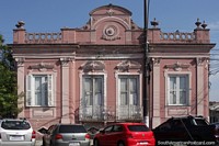An old pink building built in 1899 in Pelotas in colonial style.