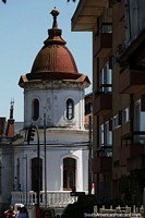 Antique building with tower and dome in Osorno.