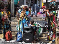 Performers in indigenous dress make music in the center of Antofagasta. Chile, South America.