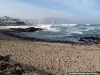 Beach in Iquique, Playa Bellavista with rough surf. Chile, South America.