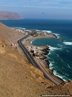 Looking down the coast away from central Arica from El Morro de Arica hill. Chile, South America.