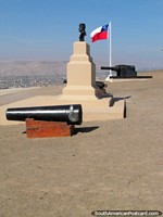 Cannon, flag, bust, another view at El Morro de Arica hill. Chile, South America.