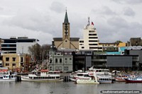 Cityscape of Valdivia with the river, boats and some historical buildings. Chile, South America.