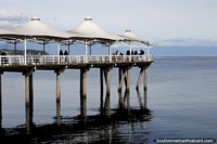 The pier out into the sea on the waterfront of Puerto Montt, gateway city. Chile, South America.