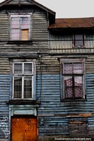 A very well-worn wooden house with 3 levels in Osorno. Chile, South America.