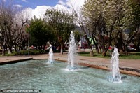 Fountain at the Plaza de Armas in Coyhaique, the plaza is like a park and shaped like a pentagon. Chile, South America.