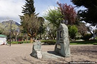 Plaza de Armas, the main square in Coyhaique with lots of trees and shade. Chile, South America.