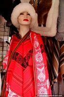 Red, white and black Chilean shawl, a fur hat, Coyhaique fashion. Chile, South America.