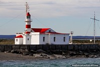 Boca Oriental, the eye-catching red and white lighthouse (1898) in Punta Delgada, Tierra del Fuego. Chile, South America.