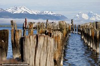 Burnt down pier in Puerto Natales, a landmark along the waterfront. Chile, South America.