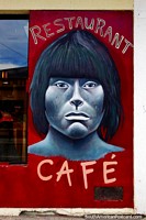 An indigenous face painted onto a restaurant and cafe in Puerto Natales. Chile, South America.