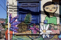 Tienda de frutas y verduras pintada con un bonito mural en el exterior que muestra sus productos en Valparaíso.