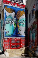 Any wall in Valparaiso is a canvas for artists and their interesting ideas, 2 large faces. Chile, South America.