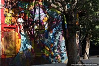 Beautiful and colorful mural covers this building on the corner in Bellavista in Santiago. Chile, South America.