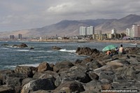 Facing northward on the coast in Antofagasta from the rocks towards the mountains.