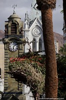 Handsome pair of buildings, the cathedral and clock tower at Plaza Colon in Antofagasta. Chile, South America.