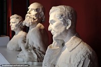 Row of white busts at the museum in Talca.