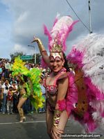 Women with feather costumes in the flower parade in Medellin. Colombia, South America.