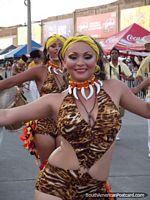 Female dancers with catlike outfits dancing at the Barranquilla Carnival. Colombia, South America.