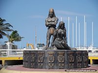 Tayrona monument at the west end of Santa Marta beach, male and female. Colombia, South America.