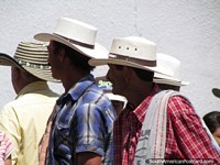 Cowboys of Penol arrive in town to socialize - well-dressed in hats, shirts and with scarves. Colombia, South America.