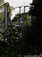 The roller coaster tracks high among the trees at the Coffee Park in Armenia. Colombia, South America.