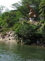Larger version of Vallenata Siren legend, the gold mermaid beside the Guatapuri River in Valledupar.