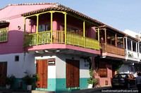 Colombia Photo - Nice colorful old houses with balconies on the corner of Calle Tumbamuertos in Cartagena.