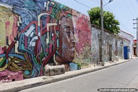The woman with colors in her hair, mural near Plaza Trinidad in Cartagena. Colombia, South America.