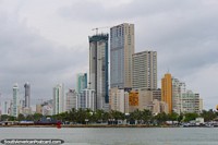 The tall modern buildings of the new city across the water from the old city of Cartagena. Colombia, South America.