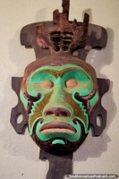Green mask depicting an ape, the work of artist Luis Alberto Acuna in Villa de Leyva. Colombia, South America.