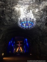 The striking chandelier and a tunnel leading through to the main chamber of the Salt Cathedral in Zipaquira. Colombia, South America.